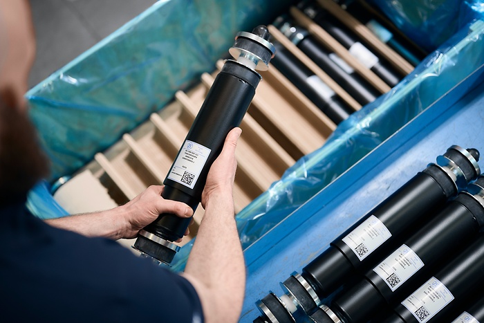 damper in hand of workshop worker