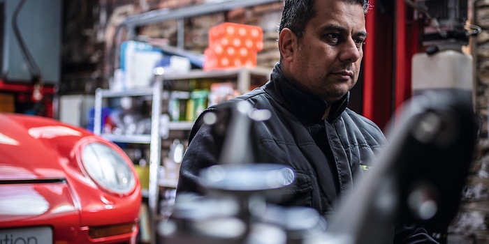 mechanic at computer in workshop