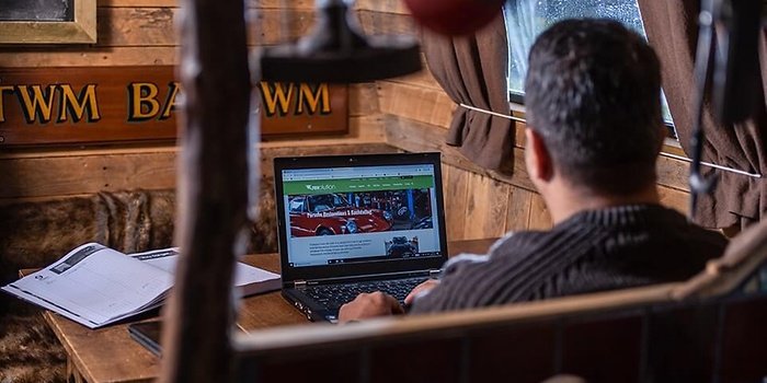 working on laptop in lodge