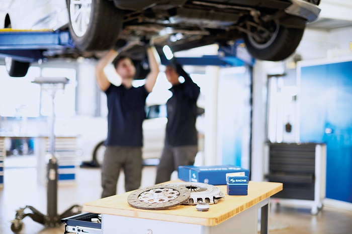 Mechnics repairing a vehicle
